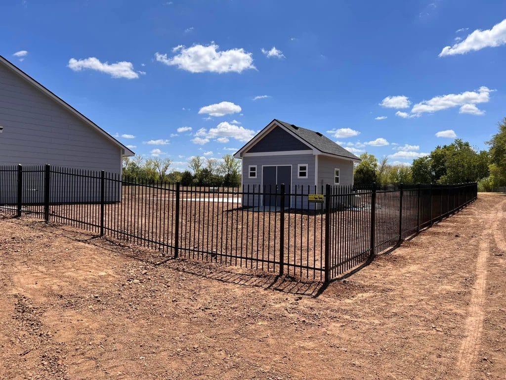 ornamental fence surrounding home