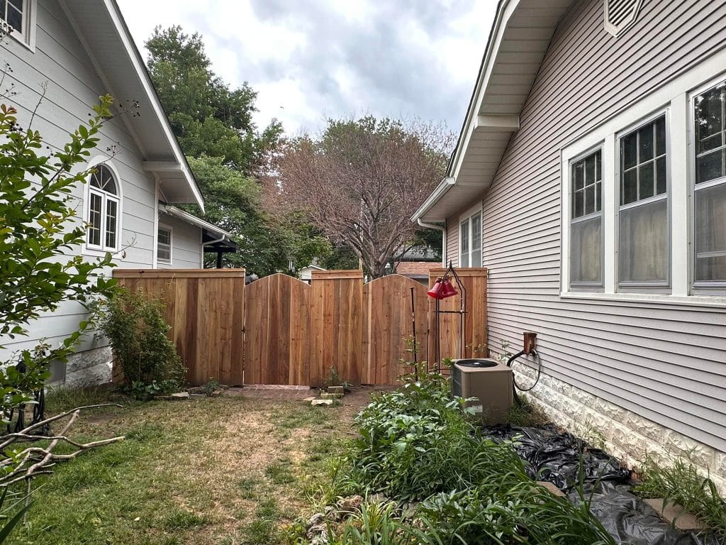 wooden fence surrounding home
