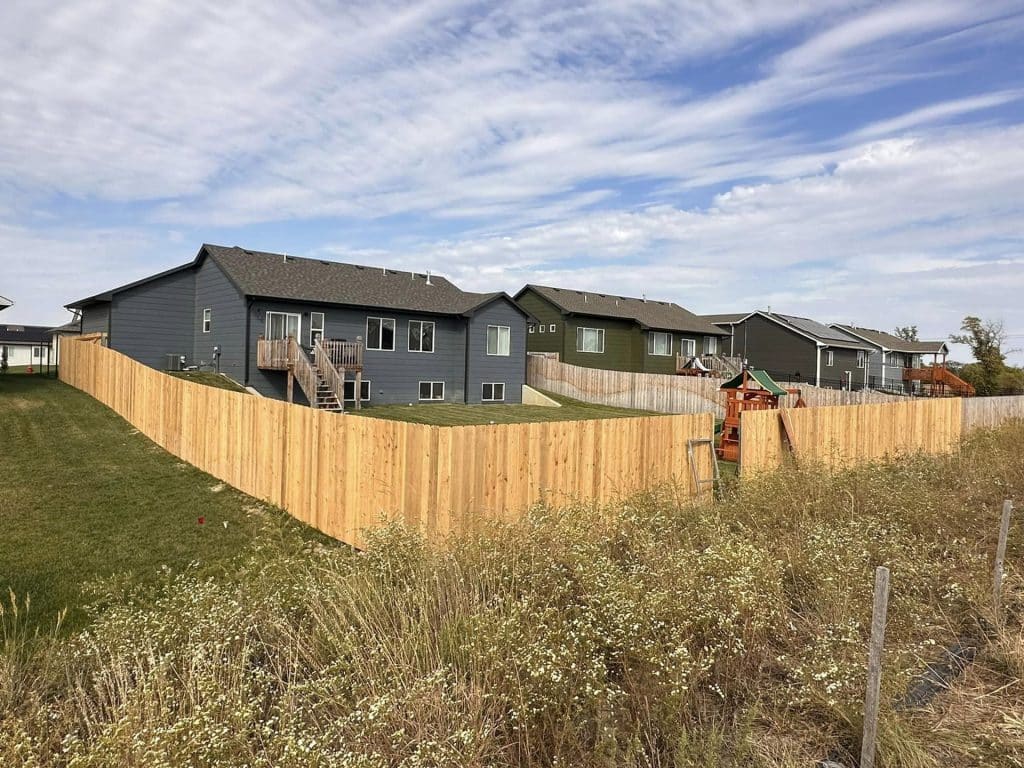 wooden fence surrounding homes
