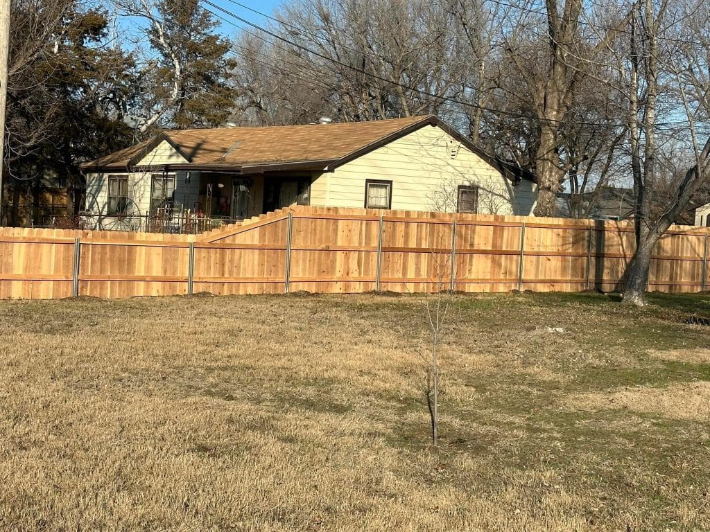wooden fence surrounding home