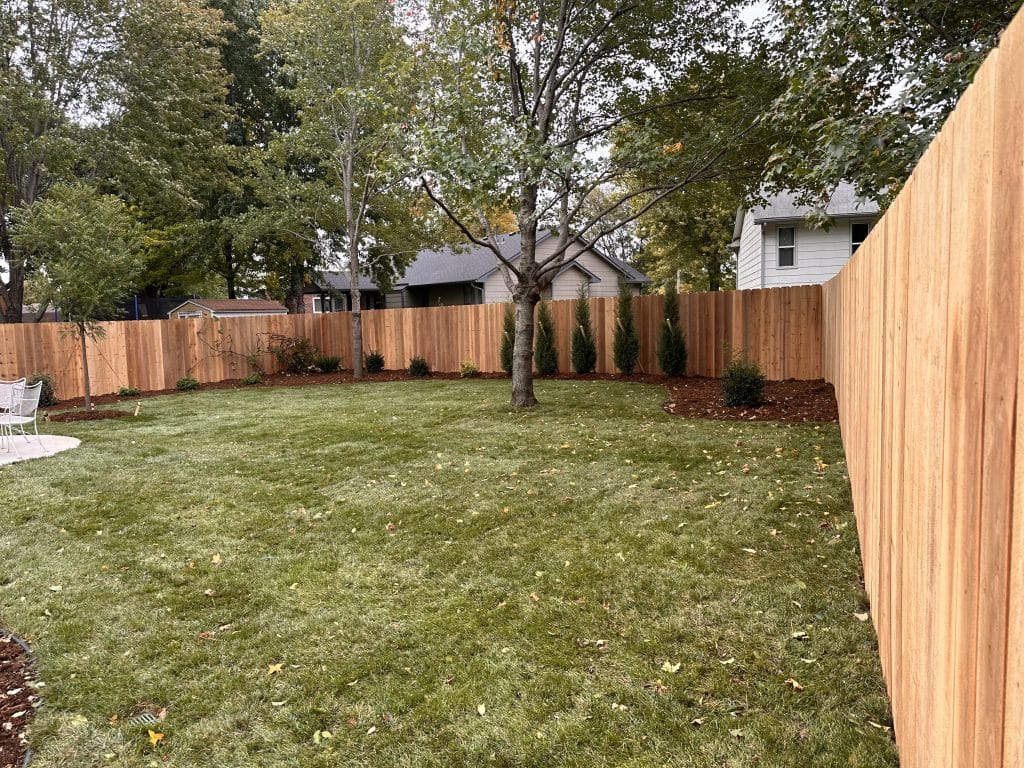 wooden fence surrounding home