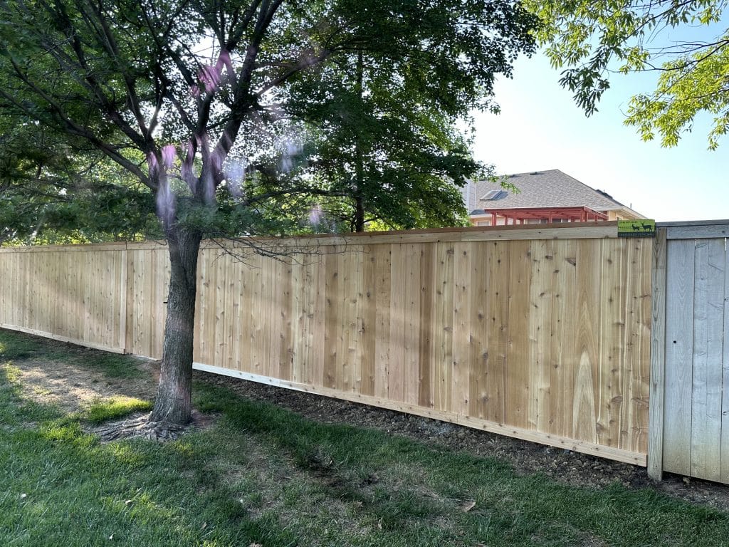 wooden fence surrounding home by Preferred Fencing in Wichita