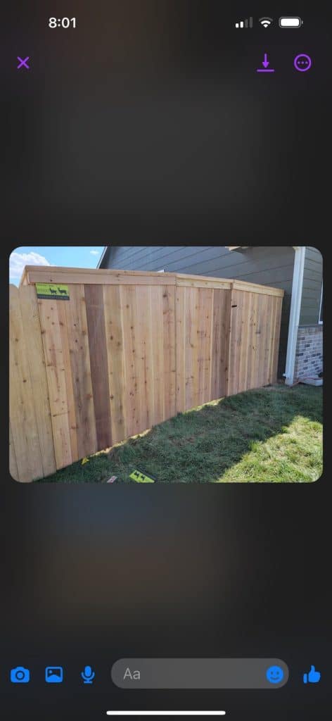 wooden fence surrounding home with entranceway